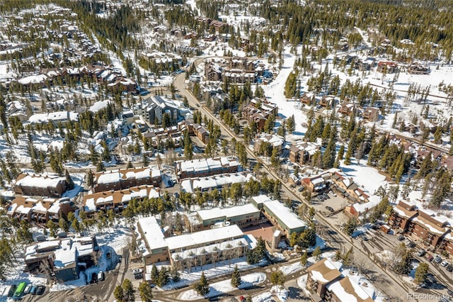 snowy aerial view featuring a residential view