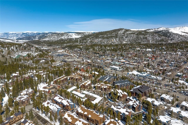 snowy aerial view featuring a mountain view