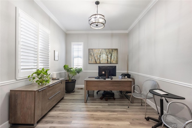 office space with ornamental molding, light wood-style floors, and an inviting chandelier