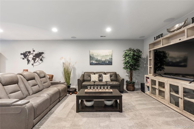 carpeted living room featuring visible vents and recessed lighting