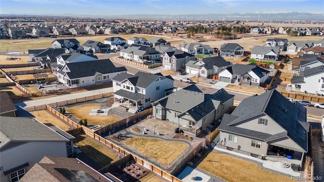 birds eye view of property with a residential view