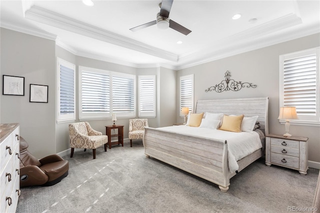 bedroom featuring light colored carpet, crown molding, baseboards, and multiple windows