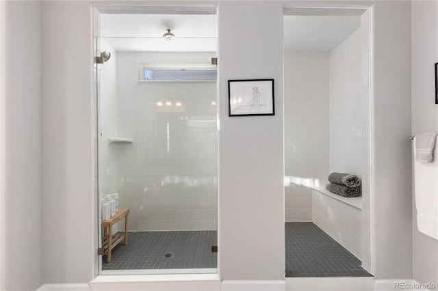 full bath with tiled shower