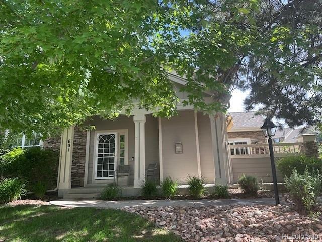 601 Clarendon Loop, Castle Pines, CO 80108 - view of front of property with stone siding