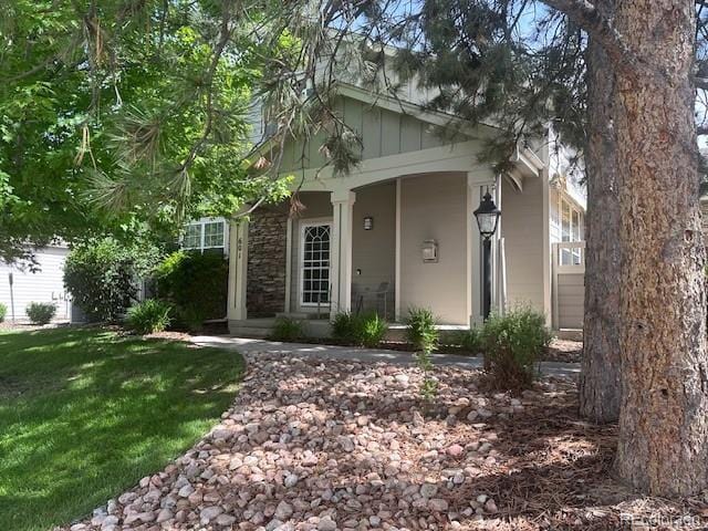 601 Clarendon Loop, Castle Pines, CO 80108 - view of front of house featuring a front yard
