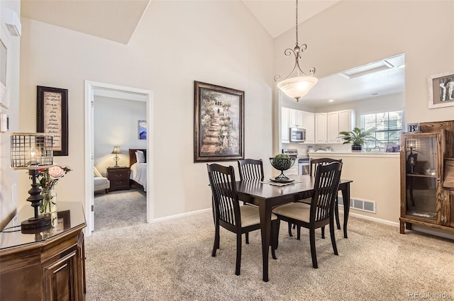 601 Clarendon Loop, Castle Pines, CO 80108 - dining space with light carpet and high vaulted ceiling