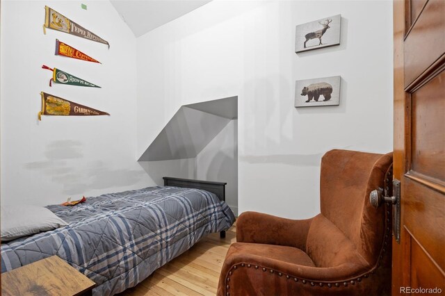 1554 N Pennsylvania St, Denver, CO 80203 - bedroom featuring hardwood / wood-style flooring and vaulted ceiling