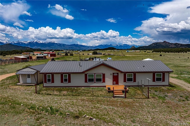 235 Blazing Saddle Trl, Cotopaxi, CO 81223 - view of front of property with a mountain view, metal roof, and a rural view