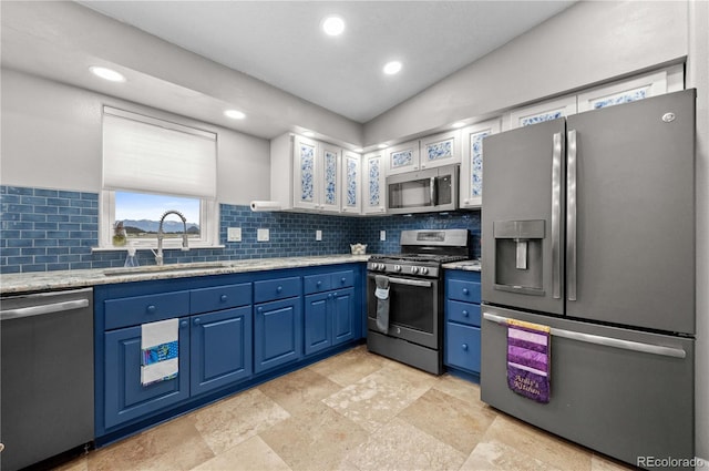 235 Blazing Saddle Trl, Cotopaxi, CO 81223 - kitchen with stainless steel appliances, a sink, blue cabinets, decorative backsplash, and recessed lighting