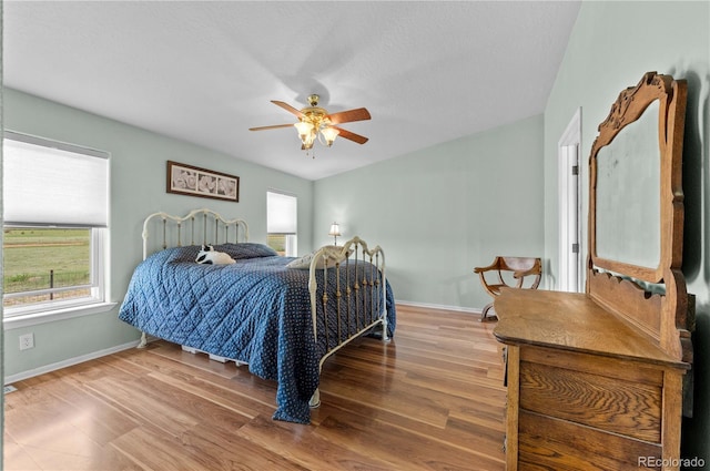 235 Blazing Saddle Trl, Cotopaxi, CO 81223 - bedroom with wood finished floors, baseboards, and a ceiling fan