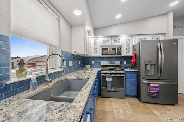 235 Blazing Saddle Trl, Cotopaxi, CO 81223 - kitchen with stainless steel appliances, a sink, blue cabinets, tasteful backsplash, and recessed lighting