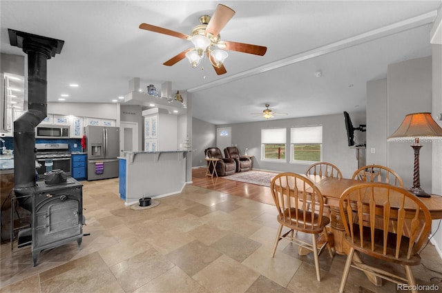 235 Blazing Saddle Trl, Cotopaxi, CO 81223 - dining area with a wood stove, a ceiling fan, baseboards, and recessed lighting