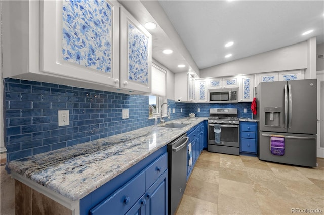 235 Blazing Saddle Trl, Cotopaxi, CO 81223 - kitchen with appliances with stainless steel finishes, a sink, blue cabinets, recessed lighting, and backsplash