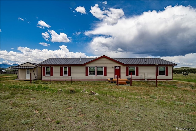 235 Blazing Saddle Trl, Cotopaxi, CO 81223 - ranch-style house featuring metal roof and a front lawn