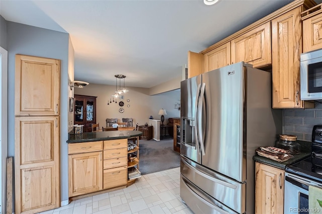 kitchen with hanging light fixtures, stainless steel appliances, light carpet, decorative backsplash, and light brown cabinetry