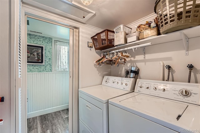 washroom featuring hardwood / wood-style floors and independent washer and dryer