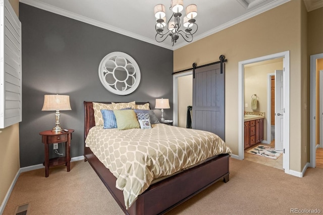 carpeted bedroom featuring ornamental molding, a barn door, a notable chandelier, and ensuite bath