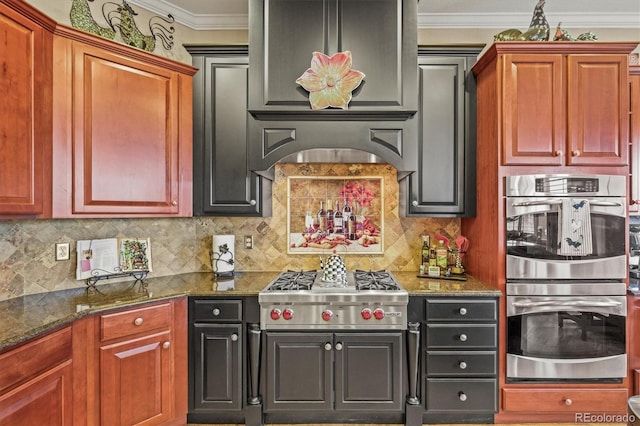 kitchen with ornamental molding, appliances with stainless steel finishes, decorative backsplash, and dark stone countertops