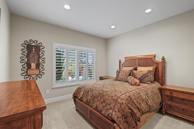 bedroom featuring light carpet