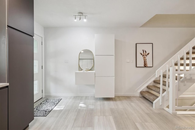 2059 S Balsam St, Lakewood, CO 80227 - foyer featuring stairs and baseboards