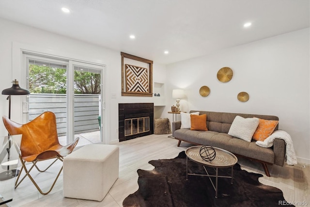 2059 S Balsam St, Lakewood, CO 80227 - living room featuring recessed lighting, a glass covered fireplace, and light wood finished floors