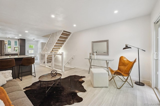 2059 S Balsam St, Lakewood, CO 80227 - living area with stairway, recessed lighting, and baseboards