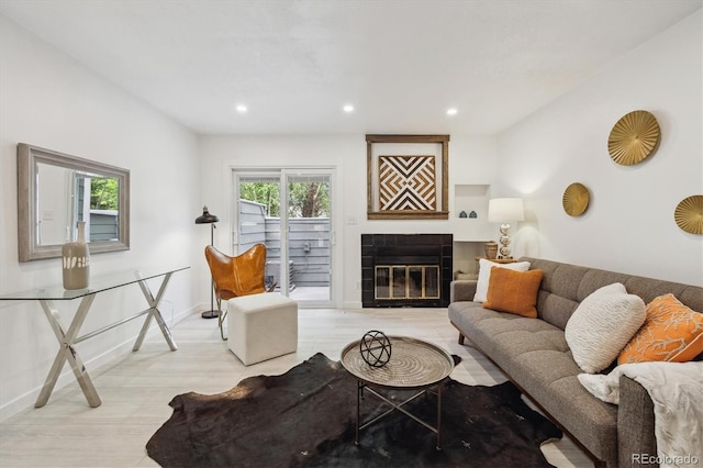 2059 S Balsam St, Lakewood, CO 80227 - living area with a tiled fireplace, recessed lighting, and baseboards