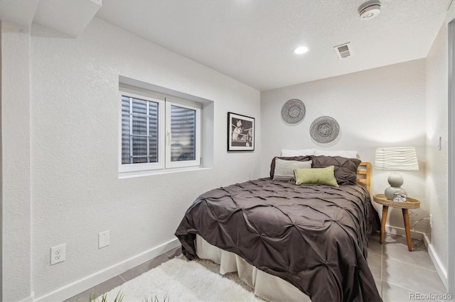 2059 S Balsam St, Lakewood, CO 80227 - tiled bedroom with baseboards and a textured wall