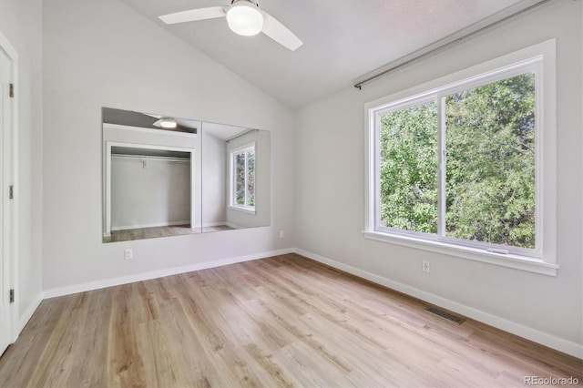 2059 S Balsam St, Lakewood, CO 80227 - empty room with lofted ceiling, wood finished floors, a ceiling fan, and baseboards