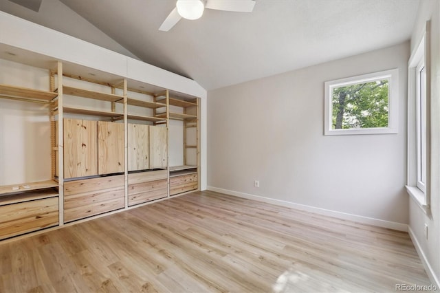 2059 S Balsam St, Lakewood, CO 80227 - unfurnished bedroom with light wood-style flooring, vaulted ceiling, baseboards, and ceiling fan