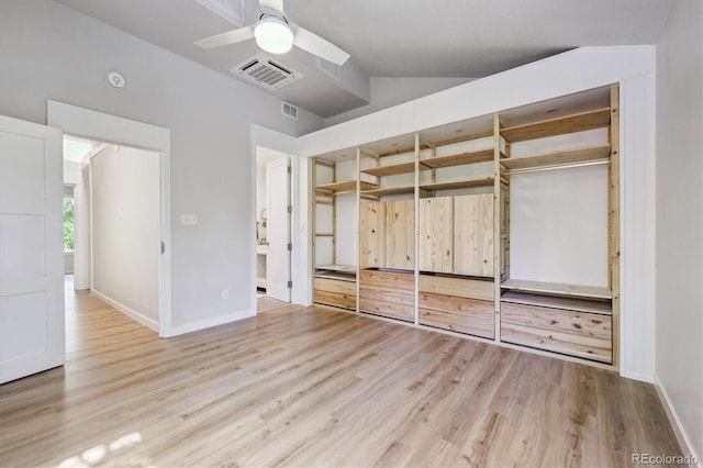 2059 S Balsam St, Lakewood, CO 80227 - unfurnished bedroom featuring wood finished floors, lofted ceiling, baseboards, and a closet