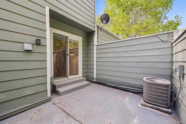 2059 S Balsam St, Lakewood, CO 80227 - entrance to property with cooling unit and a patio area