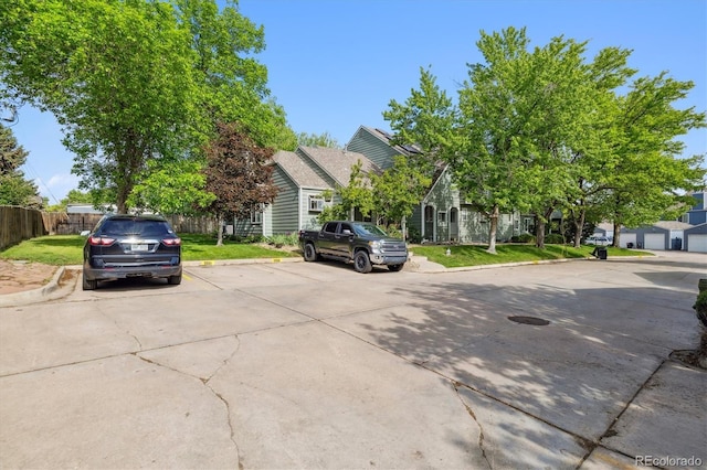 2059 S Balsam St, Lakewood, CO 80227 - view of property hidden behind natural elements with uncovered parking