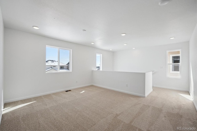 empty room with light colored carpet