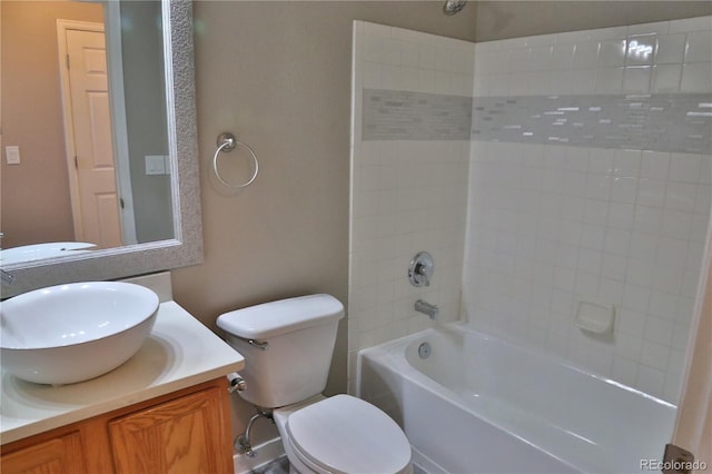 full bathroom with bathtub / shower combination, vanity, and toilet