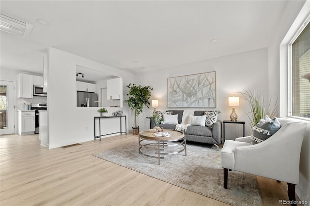 living room with light wood-type flooring