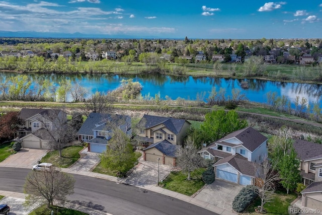 aerial perspective of suburban area with a large body of water