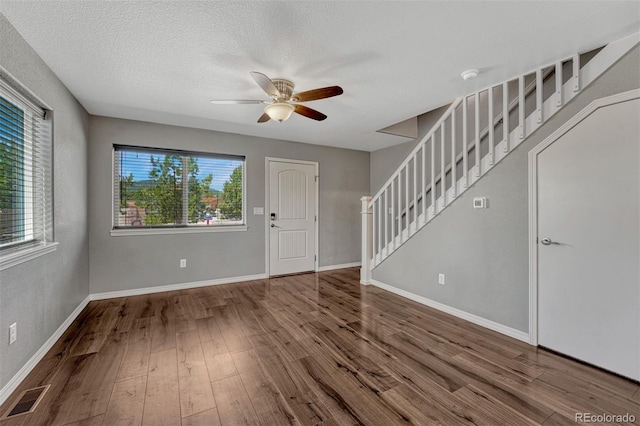 201 S Boundary St, Woodland Park, CO 80863 - entrance foyer featuring stairs, a ceiling fan, wood finished floors, and a textured ceiling