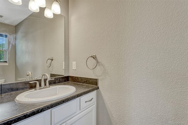 201 S Boundary St, Woodland Park, CO 80863 - bathroom with vanity and a textured wall