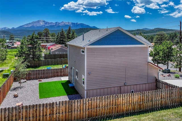 201 S Boundary St, Woodland Park, CO 80863 - view of property exterior with a mountain view and a fenced backyard