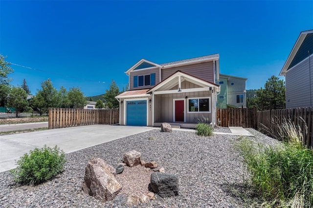 201 S Boundary St, Woodland Park, CO 80863 - view of front facade with board and batten siding, concrete driveway, and a garage
