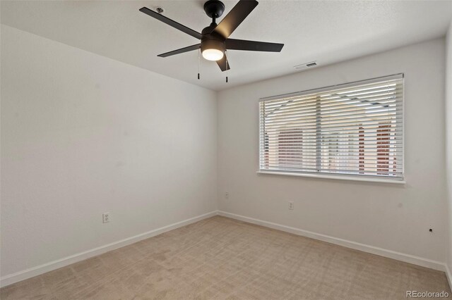 5425 County Road 32 Unit 14, Mead, CO 80504 - spare room featuring ceiling fan, light colored carpet, and baseboards