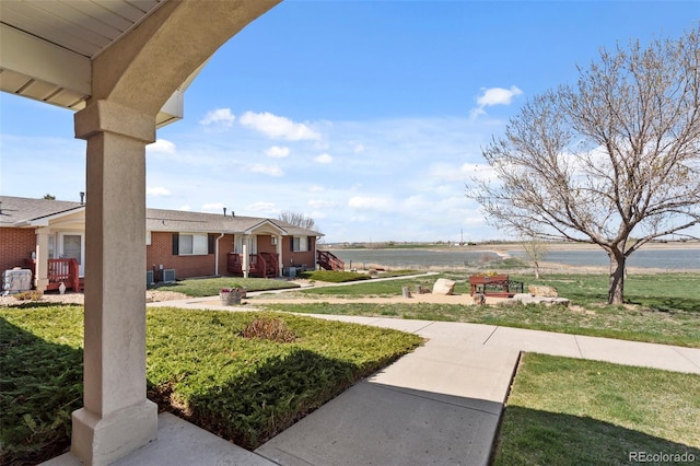 5425 County Road 32 Unit 14, Mead, CO 80504 - view of grassy yard featuring central air condition unit