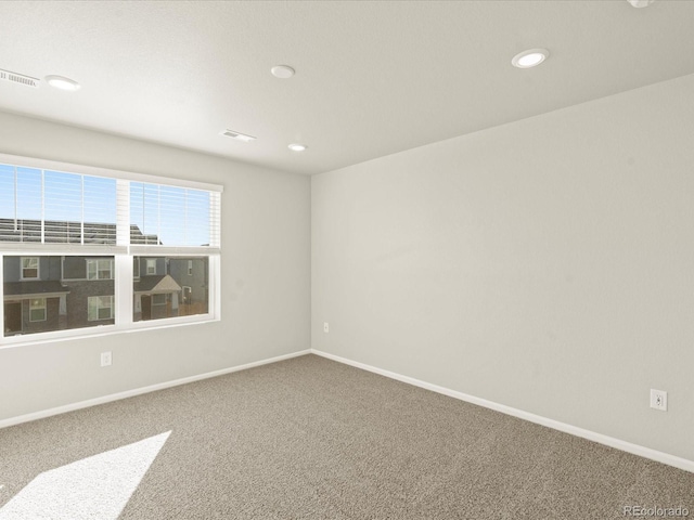 unfurnished room with carpet floors