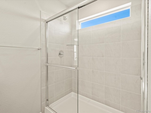 bathroom featuring an enclosed shower