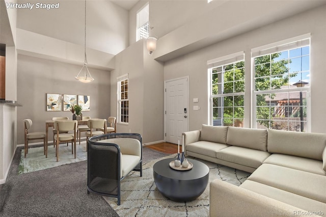 12778 Jasmine St Unit E, Thornton, CO 80602 - living room featuring healthy amount of natural light and a high ceiling