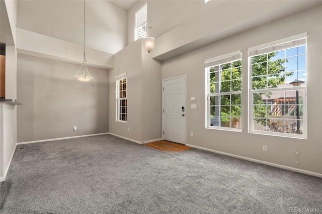 12778 Jasmine St Unit E, Thornton, CO 80602 - entrance foyer with carpet floors and healthy amount of natural light