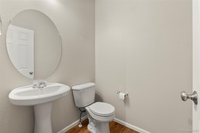 12778 Jasmine St Unit E, Thornton, CO 80602 - bathroom with wood finished floors and toilet