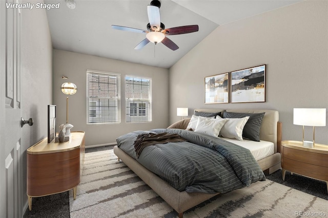 12778 Jasmine St Unit E, Thornton, CO 80602 - carpeted bedroom featuring vaulted ceiling and ceiling fan