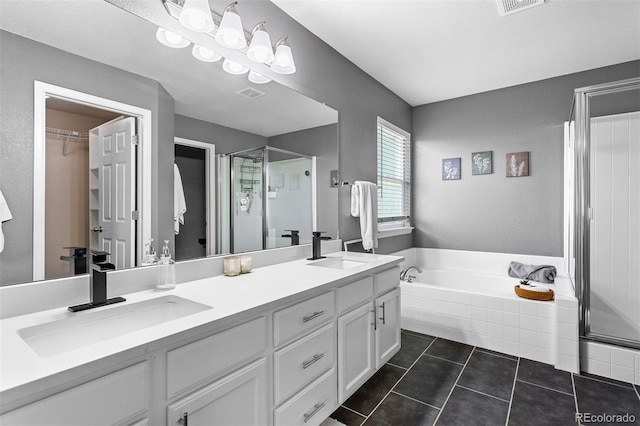3775 Balderas St, Brighton, CO 80601 - bathroom featuring a stall shower, double vanity, a garden tub, and tile patterned flooring